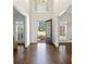 Inviting foyer with dark wood floors, an ornate front door and natural light at 4620 Chattahoochee Se Xing, Marietta, GA 30067