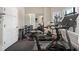 Home gym with a variety of equipment, mirrors, and natural light from a nearby window at 4620 Chattahoochee Se Xing, Marietta, GA 30067