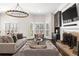 Bright living room features a decorative fireplace, neutral decor, and ample seating at 4620 Chattahoochee Se Xing, Marietta, GA 30067