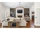 Elegant living room with custom built-ins, fireplace, and hardwood floors at 4620 Chattahoochee Se Xing, Marietta, GA 30067