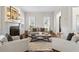 Bright living room features a decorative fireplace, neutral decor, and ample seating at 4620 Chattahoochee Se Xing, Marietta, GA 30067