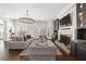 Open-concept living room with fireplace, custom built-ins, and large windows for natural light at 4620 Chattahoochee Se Xing, Marietta, GA 30067