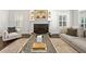 Cozy living room featuring a fireplace, elegant furnishings, and natural light at 4620 Chattahoochee Se Xing, Marietta, GA 30067