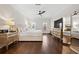 Spacious primary bedroom featuring hardwood floors, tray ceiling and large windows at 4620 Chattahoochee Se Xing, Marietta, GA 30067