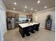 Spacious kitchen featuring a large island with seating, stainless steel appliances, and modern finishes at 1601 Bonica Xing # 1601, Cumming, GA 30040