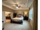Spacious main bedroom with tray ceilings, neutral carpet, and ensuite bathroom at 1601 Bonica Xing # 1601, Cumming, GA 30040