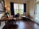 Home office area featuring wood floors, natural light, and a relaxing view of the outside at 1601 Bonica Xing # 1601, Cumming, GA 30040