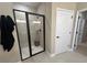 Modern shower with glass door and black trim, including rainfall showerhead and built-in bench at 1601 Bonica Xing # 1601, Cumming, GA 30040