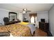 Comfortable bedroom with wood-look floors, ceiling fan, and plenty of storage in two dark wood dressers at 177 Carolyn Se Ct, Acworth, GA 30101