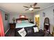 Comfortable bedroom with ceiling fan and wood-look flooring at 177 Carolyn Se Ct, Acworth, GA 30101