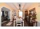 Dining room features modern light fixture, paneled walls, and wood-look floors at 177 Carolyn Se Ct, Acworth, GA 30101