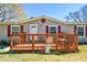 Charming home features a front porch, red shutters, and inviting curb appeal at 177 Carolyn Se Ct, Acworth, GA 30101