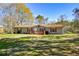 Single-story home with green yard, red shutters, and front deck at 177 Carolyn Se Ct, Acworth, GA 30101