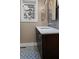 Bathroom featuring marble countertop vanity and tiled floor with a white trim window at 2724 Janellen Dr, Atlanta, GA 30345