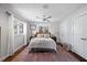 Bright bedroom with a large rug, cozy bedding, and natural light from multiple windows at 2724 Janellen Dr, Atlanta, GA 30345
