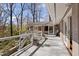 Spacious deck offers dining and lounging space with views of the surrounding trees at 2724 Janellen Dr, Atlanta, GA 30345