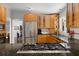 Kitchen with stainless appliances, gas cooktop and granite countertops open to living space at 2724 Janellen Dr, Atlanta, GA 30345