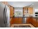 Well-lit kitchen featuring stainless steel appliances and custom cabinets at 2724 Janellen Dr, Atlanta, GA 30345