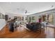 Spacious living room with hardwood floors, modern lighting, and multiple windows at 2724 Janellen Dr, Atlanta, GA 30345