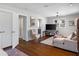 Bright living room featuring a sectional sofa, chair, hardwood floors, natural light, and easy access to other rooms at 2724 Janellen Dr, Atlanta, GA 30345