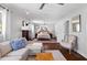 Bright living room featuring a sectional sofa, classic arm chair, and dark hardwood flooring at 2724 Janellen Dr, Atlanta, GA 30345