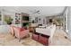 Spacious living area featuring a cozy fireplace, built-in shelves, and comfortable seating at 2724 Janellen Dr, Atlanta, GA 30345