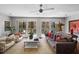 Open living room with sliding doors to the backyard deck, and an array of comfortable seating at 2724 Janellen Dr, Atlanta, GA 30345