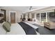 Spacious main bedroom featuring a ceiling fan, carpet flooring and windows overlooking the backyard at 2724 Janellen Dr, Atlanta, GA 30345