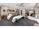 Comfortable main bedroom with ceiling fan, a sitting area, carpet flooring and side table at 2724 Janellen Dr, Atlanta, GA 30345