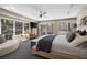 Main bedroom featuring multiple windows and doors looking out to the yard, comfortable seating and tv at 2724 Janellen Dr, Atlanta, GA 30345