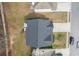 Aerial view of a home featuring a roof, driveway, backyard, and nearby street at 4145 Alveston Dr, Atlanta, GA 30349