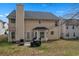 Aerial view of a home with a large, well-maintained backyard and patio space at 4145 Alveston Dr, Atlanta, GA 30349
