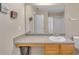 Bathroom vanity featuring a granite countertop, cabinets, a large mirror, and a white sink at 4145 Alveston Dr, Atlanta, GA 30349