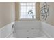 Bright bathroom features a large bathtub, white tile, and natural light at 4145 Alveston Dr, Atlanta, GA 30349