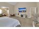 Open-concept bedroom featuring a TV, bar seating, and comfortable furnishings at 4145 Alveston Dr, Atlanta, GA 30349