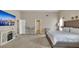 Spacious bedroom with a TV, bar seating, and comfortable furnishings at 4145 Alveston Dr, Atlanta, GA 30349