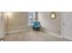 Empty bedroom with a chair by the window, providing a versatile space at 4145 Alveston Dr, Atlanta, GA 30349