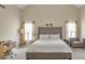 Spacious bedroom with vaulted ceiling, large bed, and a cozy seating area at 4145 Alveston Dr, Atlanta, GA 30349