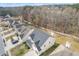 View of a two-story home with manicured lawn and backyard in a suburban neighborhood at 4145 Alveston Dr, Atlanta, GA 30349
