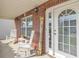 Charming front porch with rocking chairs and a decorative 'Blessed' sign, offering a warm welcome at 4145 Alveston Dr, Atlanta, GA 30349