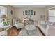 Elegant living room with hardwood floors, stylish furniture, and ample natural light for a cozy atmosphere at 4145 Alveston Dr, Atlanta, GA 30349