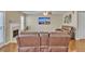 Comfortable living room features a fireplace, and a plush leather reclining sofa for relaxing and entertaining at 4145 Alveston Dr, Atlanta, GA 30349