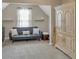 Cozy bonus room with a comfortable sofa and a bright window with sheer curtains at 4145 Alveston Dr, Atlanta, GA 30349