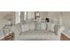 Cozy living room featuring a plush sofa and decorative pillows, perfect for relaxation and entertaining guests at 4145 Alveston Dr, Atlanta, GA 30349