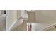 Well-lit staircase with carpeted steps leading to the upper level of the home at 4145 Alveston Dr, Atlanta, GA 30349