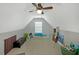 Finished attic with gray walls, easel, and abstract art at 515 Roland Manor Dr, Dacula, GA 30019
