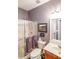 Bathroom featuring toilet, shower, vanity, and framed artwork at 515 Roland Manor Dr, Dacula, GA 30019