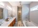 Bright bathroom features double sink vanity, soaking tub and shower at 515 Roland Manor Dr, Dacula, GA 30019