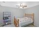 Bedroom with carpet, window, and traditional wood furniture at 515 Roland Manor Dr, Dacula, GA 30019