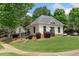 Attractive clubhouse with manicured lawn and landscaping at 515 Roland Manor Dr, Dacula, GA 30019